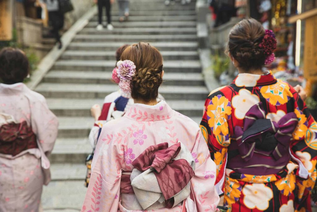 Anonymous women in traditional apparel in city. WHAT TO WEAR IN JAPAN