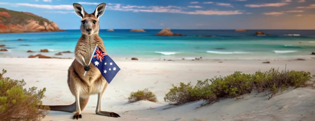 A kangaroo proudly holds the Australian flag, standing on a pristine beach with the turquoise sea behind it. Essence of Australian pride, with the iconic marsupial symbolizing the country's unique wildlife and beautiful landscapes.Best Things to Do in Australia