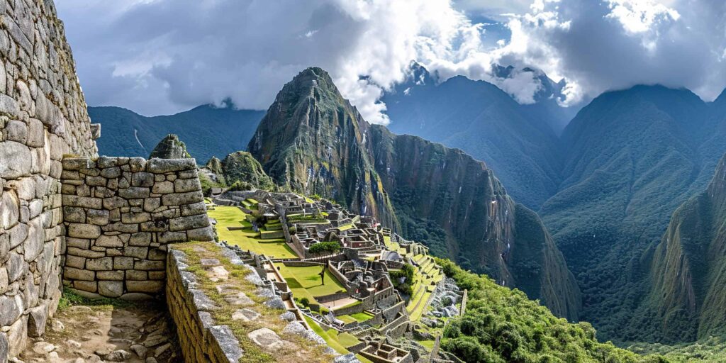 Historic Sanctuary of Machu Picchu on a mountain ridge, Eastern Cordillera of southern Peru. Incan citadel in the Andes Mountains, ancient civilization, nature panorama landscape background.Iconic Landmarks & Adventure Await! Things to Do in South America.