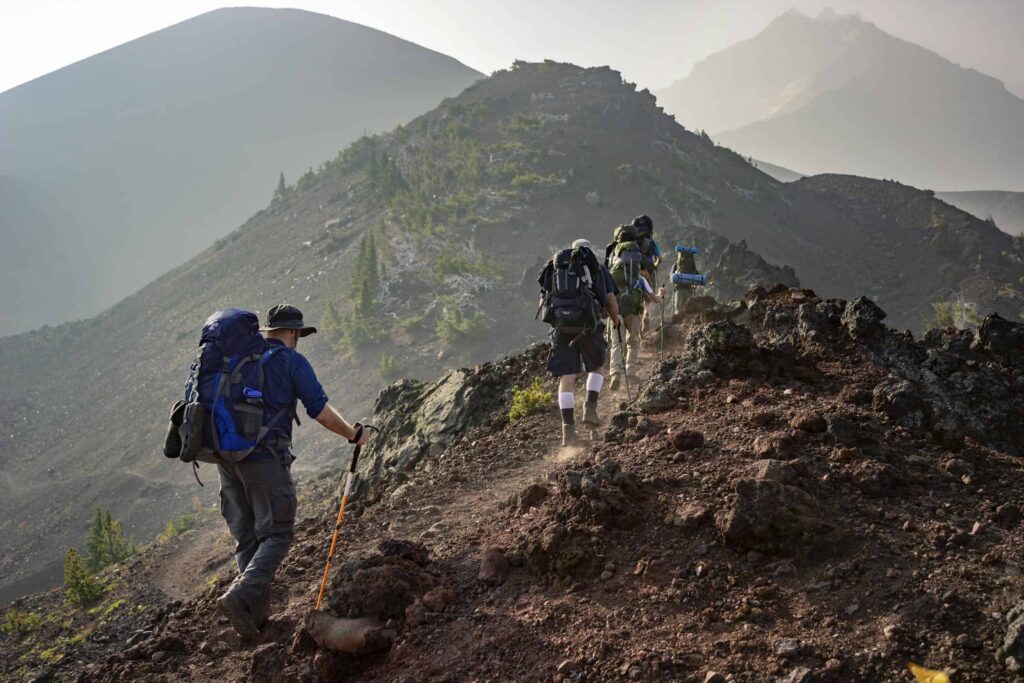 Group of Person Walking in Mountain. Difference Between Hiking and Trekking